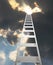 Ladder extending to a dramatic clouds