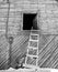 Ladder leaning against a barn loft