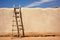 ladder leaning against a pueblo adobe wall