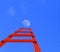 Ladder red up to moon isolated in blue background - 3d rendering