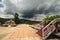 Ladder and a rooftop under stunning stormy sky