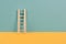 Ladder of success, opportunity strategy, blue and yellow background, copy space for text, step by step concept, progress