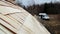 Ladders attached to the unfinished cedar wooden shingle shake roof