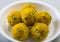 Laddu or laddoo are ball-shaped sweets popular in the Indian subcontinent.