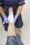 Ladies injured ankle being dressed by a nurse