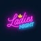 Ladies Night neon lettering on dark background.