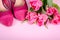 Ladies pink high heel shoe and tulips. Woman background with copy space, concept symbol for female, love, valentines and