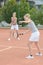 Ladies playing tennis doubles