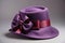 Ladies purple felt hat with ribbon bow on dark white background