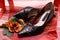 Ladies shoe on red cloth