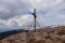 Ladinger Spitz - Scenic view on summit cross of mountain peak Grosser Sauofen, Saualpe, Lavanttal Alps, Carinthia, Austria