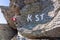 Ladinger Spitze - Path mark with Austrian flag painted on a rock marking the boarder between Carinthia and Styria, Austrian Alps