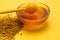 A ladle of honey on the background of a honeycomb of a bee. Honey tidbit in a glass jar honey spoon, bee bread and a