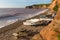 Ladram Bay beach Devon England UK with boats red sandstone rock Jurassic coast