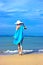 Lady in blue shawl on the beach