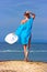 Lady in blue shawl on the beach