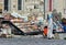 A lady and child look at the display of souvenirs for sale on a street at Uchisar in Turkey.