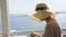 Lady choosing dish from menu at table, lunch at seaside restaurant, vacation