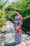 Lady with colorful kimono standing in garden