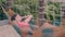 Lady with dark brown hair in red bikini sleeps in hammock