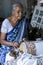 A lady demonstrates how to weave a tapestry at the Galle Fort Museum in Galle, Sri Lanka.