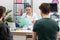 A lady doctor reviews the test results of a pregnant woman. A married couple waits for the gynecologist's opinion