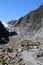 Lady on footpath Franz Josef Glacier New Zealand