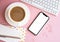 Lady freelancer's home pastel pink workplace, cup of coffee and smartphone mock-up