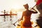 Lady friends walk kayak kayaking sea sunset