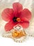Lady gift perfume, pearl necklace and hibiscus