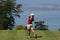 Lady golf swing at Leman lake
