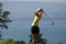 Lady golf swing at Leman lake