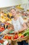 Lady in greengrocers holding wicker basket