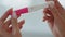 Lady hands pregnancy test holding at home closeup. Future maternity concept