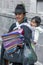 A lady with her child selling textiles at Independence Square in Quito in Ecuador in South America.