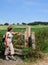 Lady Hiker standing by a gate