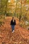 Lady Hiking An Autumn Trail