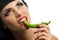 Lady holding green chilli peppers