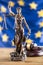 Lady Justice and European Union flag. Symbol of law and justice