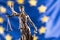 Lady Justice and European Union flag. Symbol of law and justice