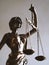 Lady justice or justitia figurine - law and jurisdiction symbol