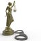 Lady of Justice statue and handcuffs 3d rendering