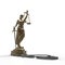 Lady of Justice statue and handcuffs 3d rendering