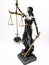 Lady Justizia with statute book and handcuffs