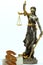 Lady Justizia with statute book and handcuffs