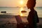 Lady with a laptop on the beach