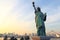 Lady liberty juxtaposed against Rainbow Bridge