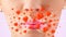 Lady lips with lovely red hearts close up