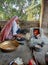 A LADY MAKE CHAPATI IN A VILLAGE OF INDIA