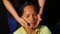 Lady masseuse shows how to massage head, face and hair